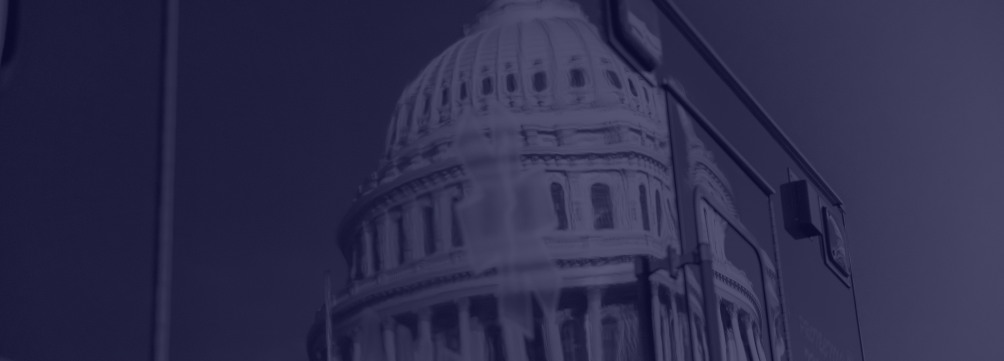 Photo of US Capitol building reflected in the door of an ambulance