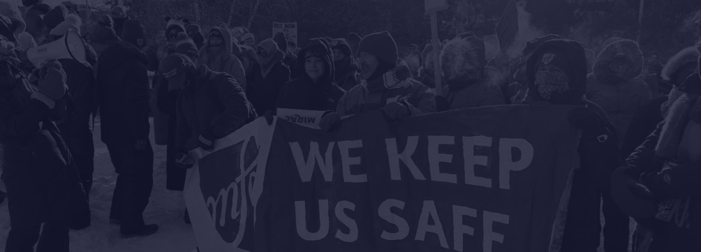 members from Education Minnesota, Saint Paul Federation of Educators, Minneapolis Federation of Educators hold up a sign that reads "We Keep Us Safe"