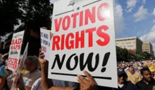 Sign reads: Voting Rights Now