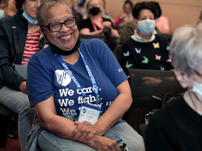 An AFT retiree smiles at AFT Retirees Conference 2022
